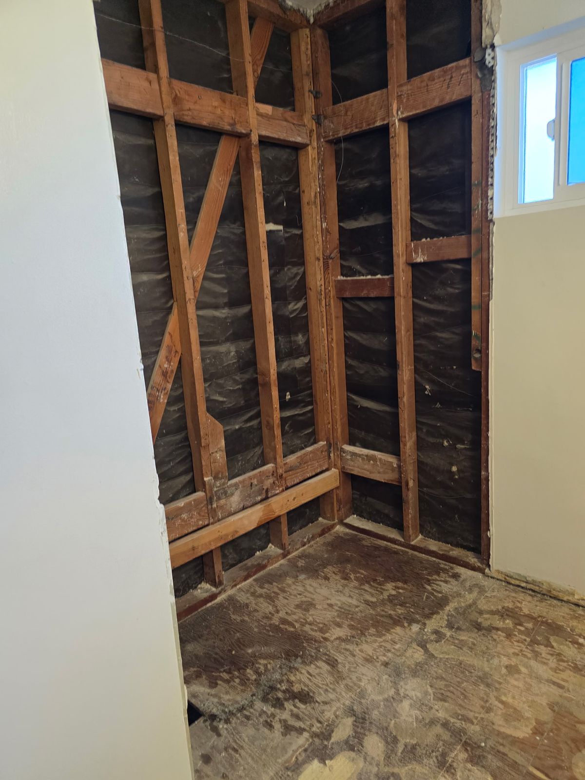 Shower alcove stripped to studs ready for new tile