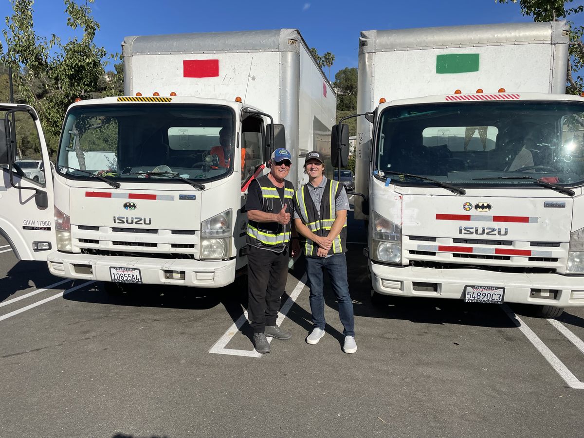 Coastal Demolition San Diego team with company Isuzu box trucks